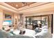 Bright living room offering water views through a large glass window overlooking the patio and canal at 257 Lido Dr, Punta Gorda, FL 33950