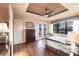 Inviting main bedroom with French doors, water view, and a decorative ceiling fan at 257 Lido Dr, Punta Gorda, FL 33950