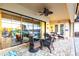 Covered patio featuring a ceiling fan, outdoor furniture, and a stunning water view at 257 Lido Dr, Punta Gorda, FL 33950