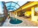 Relaxing pool area overlooking the water features a covered patio and dining area at 257 Lido Dr, Punta Gorda, FL 33950