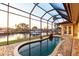 A screened-in pool area offers tranquil water views and direct access to the waterfront at 257 Lido Dr, Punta Gorda, FL 33950