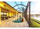 Beautiful screened in pool area with summer kitchen and scenic water views at 257 Lido Dr, Punta Gorda, FL 33950