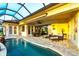 Outdoor pool area with covered patio, seating, and water views for Florida living at 257 Lido Dr, Punta Gorda, FL 33950