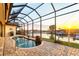 Beautiful screened in pool area with scenic waterfront views and sunset at 257 Lido Dr, Punta Gorda, FL 33950