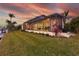Expansive screened-in lanai that is the length of the back of the property and overlooks the waterway at 257 Lido Dr, Punta Gorda, FL 33950