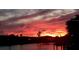 Vibrant sunset over the water creates a picturesque backdrop at 257 Lido Dr, Punta Gorda, FL 33950