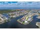 Stunning aerial view of waterfront homes on canals, showcasing community, blue skies, and luxurious coastal living at 258 Venezia Ct, Punta Gorda, FL 33950
