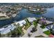 Aerial view of waterfront property with pool, lush landscaping, and boat dock at 258 Venezia Ct, Punta Gorda, FL 33950