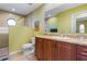 Bright bathroom with granite countertop, toilet, and a walk-in shower at 258 Venezia Ct, Punta Gorda, FL 33950