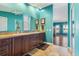 Bright bathroom showcasing a vanity with double sinks and sleek dark wood cabinetry at 258 Venezia Ct, Punta Gorda, FL 33950