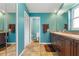 Bright bathroom with double sinks, a walk-in closet, and a separate toilet room at 258 Venezia Ct, Punta Gorda, FL 33950