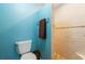Bright bathroom featuring a toilet and walk-in shower at 258 Venezia Ct, Punta Gorda, FL 33950