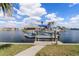 Featuring a boat dock on a sunny day with lift at 258 Venezia Ct, Punta Gorda, FL 33950