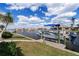 Waterfront property featuring a boat dock with lift and beautiful landscaping at 258 Venezia Ct, Punta Gorda, FL 33950