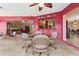 Bright dining area featuring a glass table, wicker chairs, and an open view to other rooms at 258 Venezia Ct, Punta Gorda, FL 33950