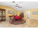 Spacious dining room features neutral tile flooring, ceiling fan, and adjacent living spaces at 258 Venezia Ct, Punta Gorda, FL 33950