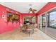 Florida room with red accent wall and view of the canal at 258 Venezia Ct, Punta Gorda, FL 33950