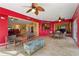 Bright Florida room with decorative ocean themed art, fans, and painted treasure chest at 258 Venezia Ct, Punta Gorda, FL 33950