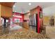 Granite countertops and stainless appliances highlight this modern kitchen overlooking the water at 258 Venezia Ct, Punta Gorda, FL 33950