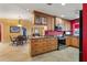 Bright kitchen featuring custom wood cabinets, granite countertops, stainless steel appliances and a dining area at 258 Venezia Ct, Punta Gorda, FL 33950