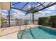 Screened pool area with waterfront views, providing a relaxing outdoor living space at 258 Venezia Ct, Punta Gorda, FL 33950