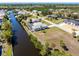 Overhead picture of a home on a canal, complemented by a screened pool and established neighborhood at 3024 Caribbean Dr, Punta Gorda, FL 33950