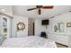 Bright bedroom with ceiling fan, neutral decor, and bright lighting at 3024 Caribbean Dr, Punta Gorda, FL 33950