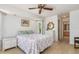 Bright bedroom features a ceiling fan, and neutral decor at 3024 Caribbean Dr, Punta Gorda, FL 33950