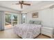 Bedroom with sliding glass doors to the pool and neutral decor at 3024 Caribbean Dr, Punta Gorda, FL 33950