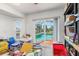 Cluttered bonus room with sliding glass doors leading to a pool area at 3024 Caribbean Dr, Punta Gorda, FL 33950