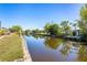 Scenic view of the canal behind the property, lined with lush tropical plants and greenery at 3024 Caribbean Dr, Punta Gorda, FL 33950