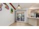 Bright dining room with sliding glass doors to patio and access to the kitchen at 3024 Caribbean Dr, Punta Gorda, FL 33950