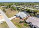 Beautiful waterfront property with a screened-in pool and lush landscaping at 3024 Caribbean Dr, Punta Gorda, FL 33950