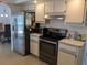 This spacious kitchen showcases stainless appliances, white cabinetry, and ample counter space at 3024 Caribbean Dr, Punta Gorda, FL 33950