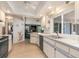 Charming kitchen featuring fan, ample countertops, black appliances, and seamless living area access at 3024 Caribbean Dr, Punta Gorda, FL 33950