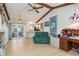 Bright, open concept living room with sliding doors to patio and access to kitchen at 3024 Caribbean Dr, Punta Gorda, FL 33950