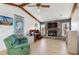 Cozy living room with stone fireplace, wood beams, and neutral decor at 3024 Caribbean Dr, Punta Gorda, FL 33950