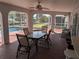 Screened-in patio area with dining furniture overlooking the pool and beautiful waterway at 3024 Caribbean Dr, Punta Gorda, FL 33950