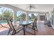 Covered patio with seating area offers a relaxing outdoor space near the pool at 3024 Caribbean Dr, Punta Gorda, FL 33950
