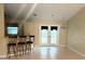 Bright dining area featuring tiled flooring and a view of the back patio at 3148 Draper Ter, North Port, FL 34286