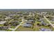 A scenic aerial shot displays the community, featuring manicured lawns and a peaceful setting at 321 Pessoa St, Punta Gorda, FL 33983