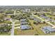 Community aerial showcases the meticulously landscaped streets and variety of single-Gathering homes at 321 Pessoa St, Punta Gorda, FL 33983