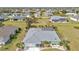 Overhead view of a single-Gathering home, highlighting the roof and yard in a residential area at 321 Pessoa St, Punta Gorda, FL 33983