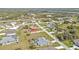 Panoramic aerial view of the neighborhood with lush greenery and diverse architectural styles at 321 Pessoa St, Punta Gorda, FL 33983