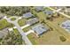 This aerial view showcases a lovely neighborhood with well-maintained homes and mature landscaping at 321 Pessoa St, Punta Gorda, FL 33983