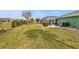Spacious backyard featuring an enclosed pool area and well-maintained lawn at 321 Pessoa St, Punta Gorda, FL 33983