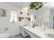 Bathroom features dual sinks, ample counter space, and decorative nautical-themed accents at 321 Pessoa St, Punta Gorda, FL 33983