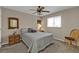 Cozy bedroom with carpet, ceiling fan, neutral wall paint, and classic furnishings at 321 Pessoa St, Punta Gorda, FL 33983