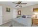 Comfortable bedroom with ceiling fan, neutral paint and carpet, a queen bed and traditional furniture at 321 Pessoa St, Punta Gorda, FL 33983