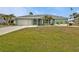 Inviting single-story home with well-kept lawn and bright exterior paint at 321 Pessoa St, Punta Gorda, FL 33983
